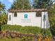 Elegant entrance sign for Indigo at Lakewood Ranch surrounded by manicured landscaping and palm trees at 12706 Cobalt Ter, Bradenton, FL 34211
