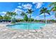 Close-up of a large, inviting community pool with ample seating and well-maintained surrounding pavers at 12706 Cobalt Ter, Bradenton, FL 34211