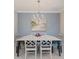A charming dining room with a stylish chandelier, artwork, and beautiful decor at 12706 Cobalt Ter, Bradenton, FL 34211