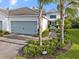 Charming one-story home with a two car garage, manicured landscaping, and a paver walkway leading to the front door at 12706 Cobalt Ter, Bradenton, FL 34211