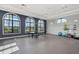 Bright game room with a ping pong table, exercise equipment, and large windows offering plenty of natural light at 12706 Cobalt Ter, Bradenton, FL 34211