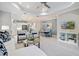 Open floor plan features a living room, dining area and kitchen with white cabinets at 12706 Cobalt Ter, Bradenton, FL 34211