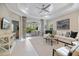 Comfortable living room with white furnishings, stylish decor, and view of the outdoor patio at 12706 Cobalt Ter, Bradenton, FL 34211
