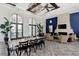 Spacious lounge area featuring a fireplace, comfortable seating, and elegant decor perfect for gatherings at 12706 Cobalt Ter, Bradenton, FL 34211