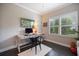 Office space featuring a hardwood floors, plantation shutters, and desk at 12706 Cobalt Ter, Bradenton, FL 34211