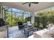 A screened lanai with a grill and outdoor seating at 12706 Cobalt Ter, Bradenton, FL 34211