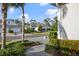 Street view of a well-kept neighborhood with manicured lawns, mature trees, and brick paver driveways at 12706 Cobalt Ter, Bradenton, FL 34211