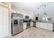 Well-equipped kitchen with stainless steel appliances, a pantry, and sleek countertops at 13257 Sw 29Th Cir, Ocala, FL 34473