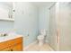 Bathroom features a single sink vanity and a shower, with light blue paint and tile flooring at 1401 Francis Ave, Sarasota, FL 34232