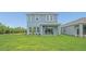 A spacious lawn, with lush grass and landscaping, in the backyard of the home at 15001 Shady Palms Ln, Nokomis, FL 34275