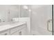 Contemporary bathroom featuring a glass shower and vanity with sleek hardware at 15001 Shady Palms Ln, Nokomis, FL 34275