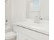 Bright bathroom featuring a single sink vanity, modern fixtures, and a toilet at 15001 Shady Palms Ln, Nokomis, FL 34275