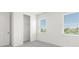Clean bedroom featuring neutral carpet, windows, and closet for ample storage at 15001 Shady Palms Ln, Nokomis, FL 34275