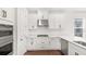 Well-appointed kitchen showcasing white cabinetry, stainless steel appliances, and modern hardware finishes at 15001 Shady Palms Ln, Nokomis, FL 34275