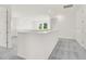 Upstairs loft area featuring carpeted floors and great natural light at 15001 Shady Palms Ln, Nokomis, FL 34275