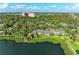 Stunning aerial view of a lakeside community surrounded by lush greenery and beautiful waterfront access at 1617 Bayhouse Ct # 121, Sarasota, FL 34231