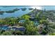 Expansive aerial shot of a luxury community with multiple pools and beautifully maintained landscaping overlooking the bay at 1617 Bayhouse Ct # 121, Sarasota, FL 34231