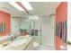 Bathroom featuring granite counter, a walk-in shower with sliding glass doors, and modern fixtures at 1617 Bayhouse Ct # 121, Sarasota, FL 34231