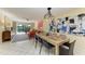 Open dining and living area with modern decor, ample seating, and natural light at 1617 Bayhouse Ct # 121, Sarasota, FL 34231