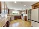 Well-maintained kitchen with wood cabinetry, stainless steel appliances, and ample counter space at 1617 Bayhouse Ct # 121, Sarasota, FL 34231