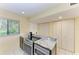 Eat-in kitchen featuring granite counters, modern appliances, and ample storage space at 1617 Bayhouse Ct # 121, Sarasota, FL 34231