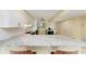 Open kitchen featuring granite counters, bright cabinets, and modern appliances at 1617 Bayhouse Ct # 121, Sarasota, FL 34231