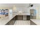 Modern kitchen with granite counters, stainless steel appliances, and white and gray cabinets at 1617 Bayhouse Ct # 121, Sarasota, FL 34231