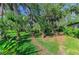Lush greenery and winding paths create a serene and inviting outdoor space, surrounded by beautiful foliage at 1617 Bayhouse Ct # 121, Sarasota, FL 34231