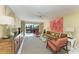 Inviting living room with a sliding glass door to the outside, comfortable seating, and a ceiling fan at 1617 Bayhouse Ct # 121, Sarasota, FL 34231