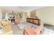 Open-concept living room flows into the dining area, with comfortable seating and stylish décor at 1617 Bayhouse Ct # 121, Sarasota, FL 34231