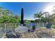 Relaxing patio area with outdoor furniture, offering a serene space to unwind and enjoy the views at 1617 Bayhouse Ct # 121, Sarasota, FL 34231