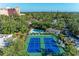 Birds-eye perspective on vibrant community tennis courts, highlighting the community's commitment to recreation at 1617 Bayhouse Ct # 121, Sarasota, FL 34231