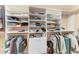 Spacious walk-in closet features custom shelving and ample storage for clothing and accessories at 1617 Bayhouse Ct # 121, Sarasota, FL 34231