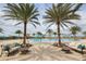 Resort-style community pool area with lounge seating, palm trees, and water features for relaxation at 16309 Castle Park Ter, Lakewood Ranch, FL 34202