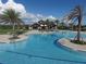 Stunning community pool with zero entry, cabana, and tropical landscaping, offering a resort-like atmosphere at 16309 Castle Park Ter, Lakewood Ranch, FL 34202
