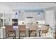 Contemporary kitchen with white cabinetry, large island, pendant lighting, and stainless steel appliances at 16309 Castle Park Ter, Lakewood Ranch, FL 34202