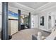 Spacious main bedroom suite with TV, walkout access, and sitting area at 16309 Castle Park Ter, Lakewood Ranch, FL 34202