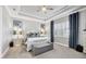 Comfortable main bedroom with light grey walls, white furniture, and shuttered windows at 16309 Castle Park Ter, Lakewood Ranch, FL 34202