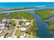 Beautiful waterfront home with lush landscaping and canal access to the Gulf of Mexico and open bay at 1680 Lemon Bay Dr, Venice, FL 34293