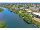 Aerial view showcasing the home's proximity to the water and the private dock at 1680 Lemon Bay Dr, Venice, FL 34293