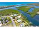 Aerial shot showing the home's waterfront position, canal access, and proximity to the bay at 1680 Lemon Bay Dr, Venice, FL 34293