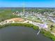 Aerial view of the property highlighting its access to the water and the surrounding neighborhood at 1680 Lemon Bay Dr, Venice, FL 34293