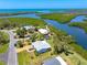 Lovely aerial shot of the house in a neighborhood with access to the intercoastal and gulf waters at 1680 Lemon Bay Dr, Venice, FL 34293