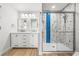 Stylishly renovated bathroom with a double vanity and glass-enclosed shower at 1680 Lemon Bay Dr, Venice, FL 34293
