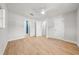 Light-filled bedroom features a ceiling fan and wood-look floors at 1680 Lemon Bay Dr, Venice, FL 34293