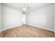 Bedroom featuring wood-look floors and a large closet at 1680 Lemon Bay Dr, Venice, FL 34293