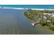 Picturesque waterfront dock surrounded by lush mangrove islands leading to the beach at 1680 Lemon Bay Dr, Venice, FL 34293