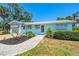 Charming home featuring a well-manicured front yard and beautiful curb appeal at 1680 Lemon Bay Dr, Venice, FL 34293
