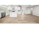 Spacious kitchen features white cabinets, a marble center island, stainless appliances, and modern finishes at 1680 Lemon Bay Dr, Venice, FL 34293
