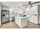 Modern kitchen with white cabinetry, stainless steel appliances, and an island at 1680 Lemon Bay Dr, Venice, FL 34293